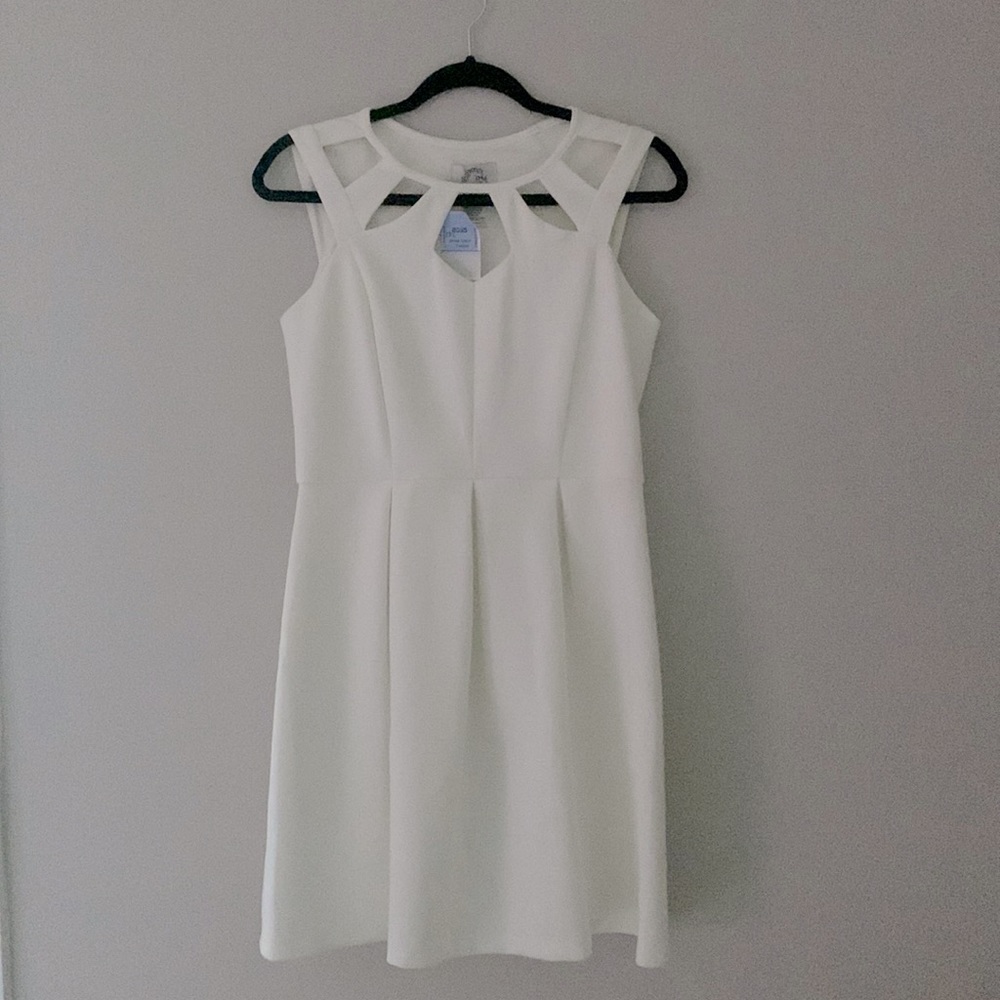 NEW WITH TAGS. White dress, empire waist and cut out neckline.